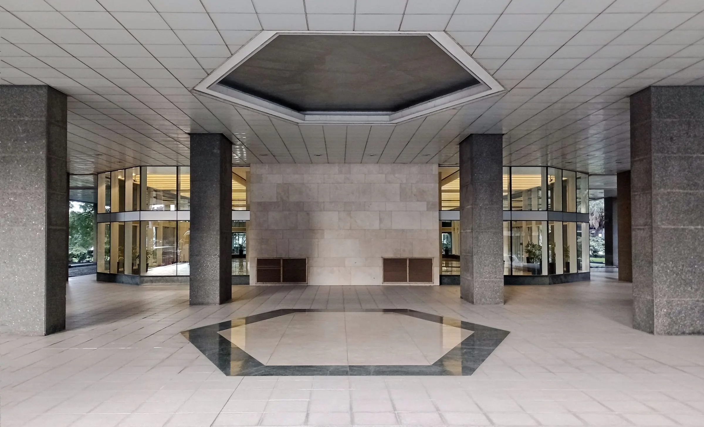 Clean office building lobby with polished stone floor