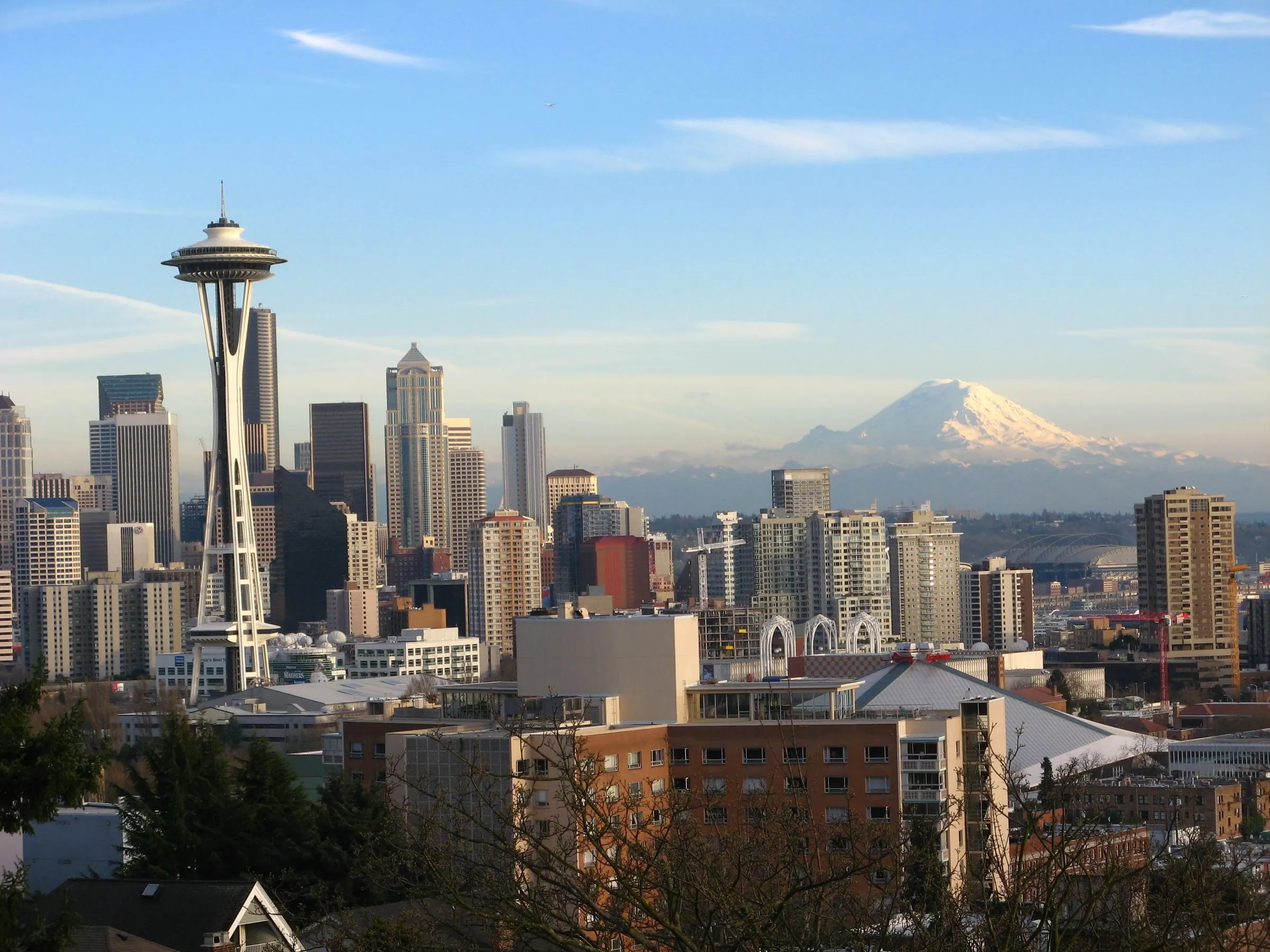 Seattle skyline with the Space Needle and Mount Rainier, home to the office buildings Advantage cleans