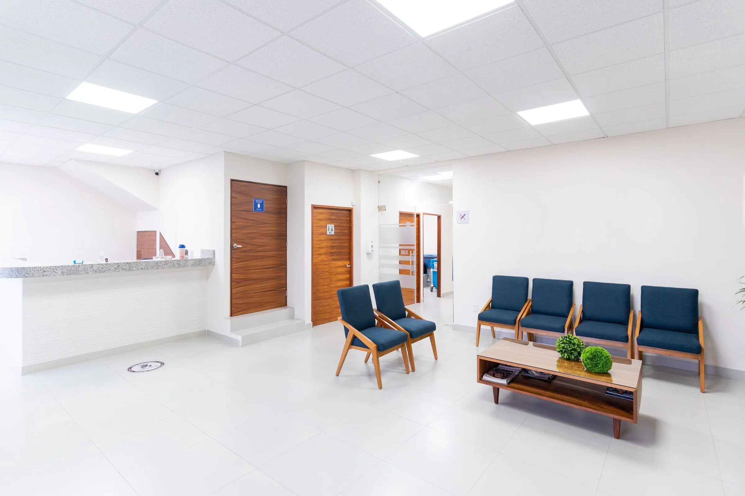 Bright, spotless medical clinic waiting room and reception after professional medical office cleaning