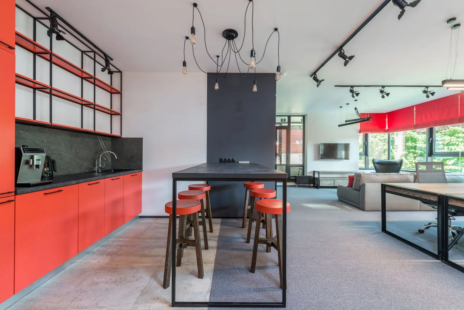 Clean, modern office breakroom with counters and stools wiped down