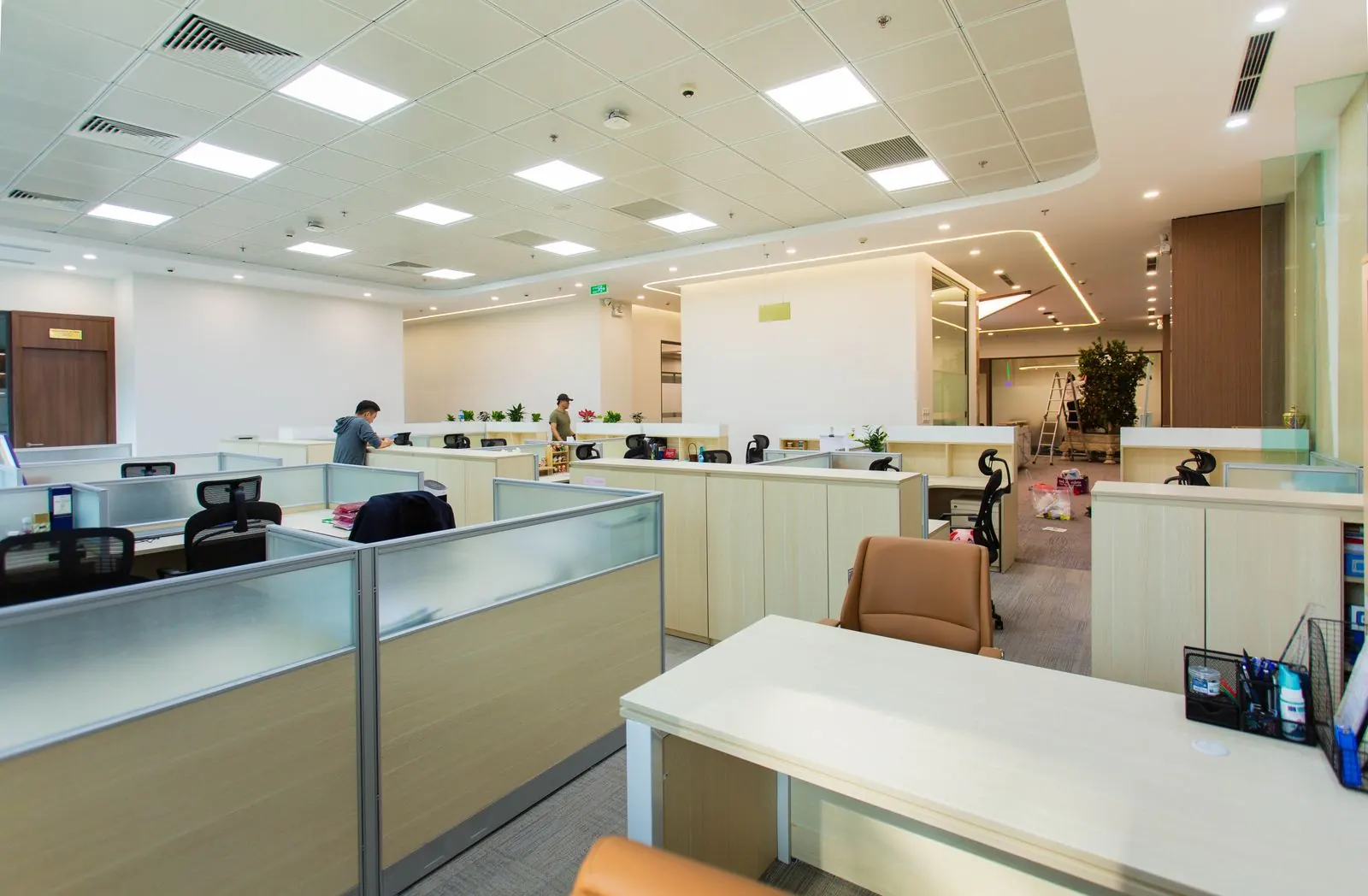 Clean open-plan office with tidy workstations ready for the next business day